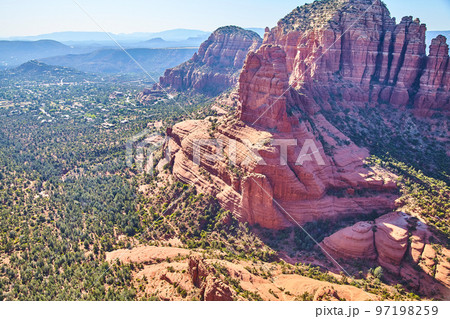 Landscape aerial of large red rock mountains in desert 97198259