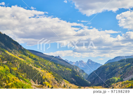 Bottom of valley surrounded by vast mountains Bottom of valley surrounded by vast mountains 97198289