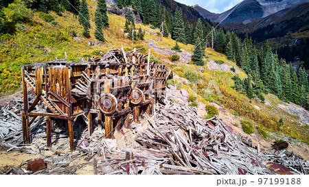 Detail of old beautiful mining mill equipment abandoned and falling apart in the mountains Detail of old beautiful mining mill equipment abandoned and falling apart in the mountains 97199188