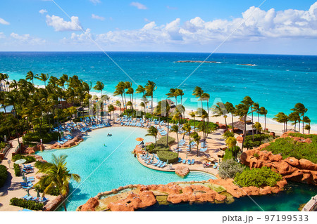 Tropical vacation with pools and palm trees Tropical vacation with pools and palm trees 97199533