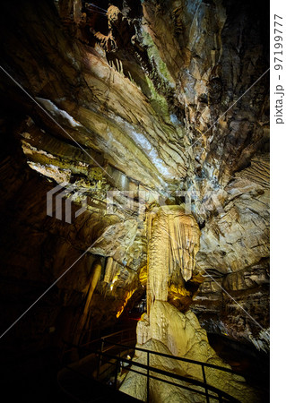 Cave formations on walkway underground with stalagmites and stalactites 97199777