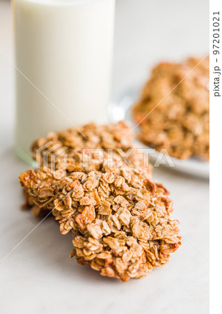 Sweet oatmeal cookies on white kitchen table. 97201021