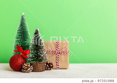 Christmas composition. Gifts, small tree, branches and craft DIY decorations on white background. New year concept. Christmas home decoration Flat lay, top view, copy space 97201988