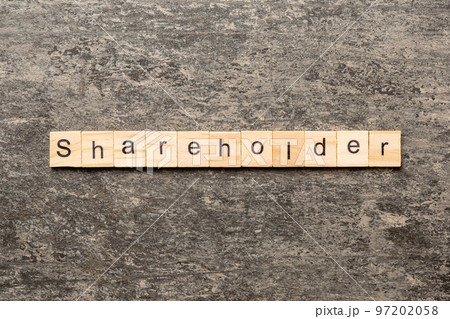 shareholder word written on wood block. shareholder text on table, concept shareholder word written on wood block. shareholder text on table, concept 97202058