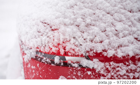 Close-up of snow frozen on a car. The concept of weather conditions 97202200