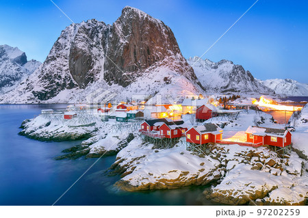 Outstanding sunset winter view on Hamnoy village and Festhaeltinden mountain on background. 97202259