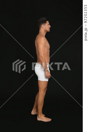 Handsome man in underwear on black background 97202355