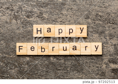 Happy February word written on wood block. Happy February text on table, concept 97202513