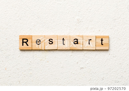 restart word written on wood block. restart text on table, concept restart word written on wood block. restart text on table, concept 97202570