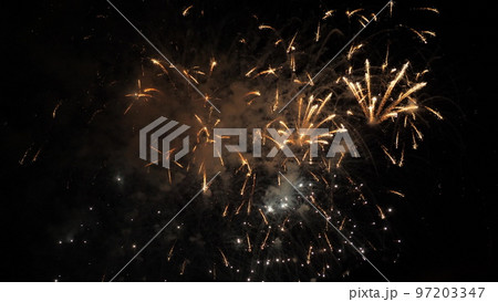 fireworks background. festive fireworks sky. new year, independence day, christmas, birthday. explosion colored lights. fiery flame sky. happy holiday. traditional holiday festival. fire spark effect 97203347