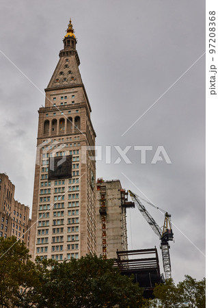 New York City building with front clock covered for construction 97208368