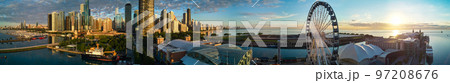 Stunning panorama of Chicago Navy Pier at sunrise with ferris wheel and city skyline Stunning panorama of Chicago Navy Pier at sunrise with ferris wheel and city skyline 97208676