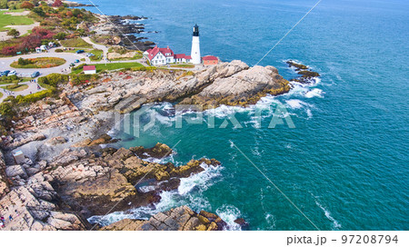 Wide panorama aerial over Portland Head lighthouse with rocky coast Wide panorama aerial over Portland Head lighthouse with rocky coast 97208794