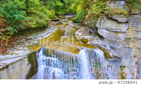 Detail of edge of large waterfall looking down river from aerial view 97208841