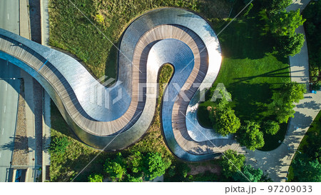 Wavy snake metal path of Pedestrian bridge from above at Millennium Park in Chicago 97209033
