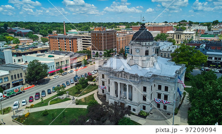 Aerial of downtown Courthouse in Bloomington Indiana with shops Aerial of downtown Courthouse in Bloomington Indiana with shops 97209094