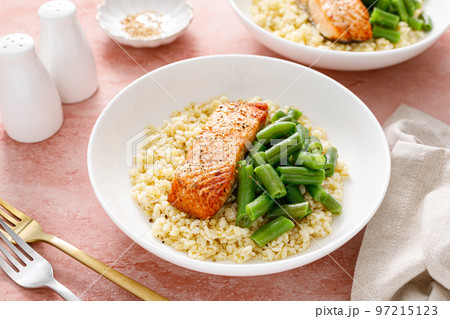 Salmon fillet grilled with bulgur and green beans. Healthy food, diet Salmon fillet grilled with bulgur and green beans. Healthy food, diet 97215123