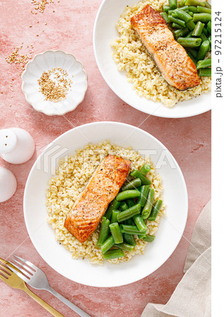 Salmon fillet grilled with bulgur and green beans. Healthy food, diet. Top view Salmon fillet grilled with bulgur and green beans. Healthy food, diet. Top view 97215124