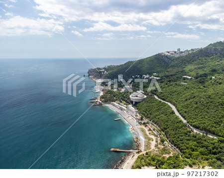 Christian church in the mountains above the sea. Temple of the Holy Archangel Michael in Oreanda. The southern coast of Crimea. Aerial view 97217302