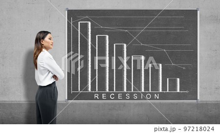 Asian businesswoman looking at the decreased graph 97218024