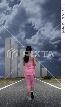 Rear view of Asian woman running Rear view of Asian woman running 97218337