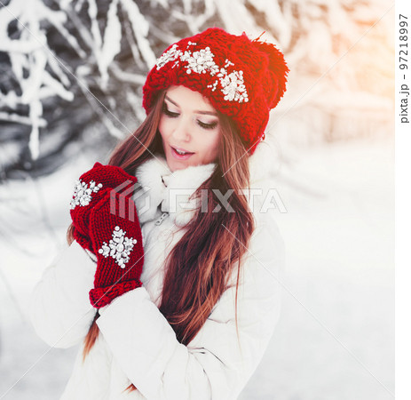 Fashion happy woman in knitted red hat 97218997