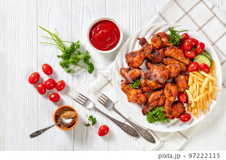 roast chicken wings with french fries and veggies 97222115