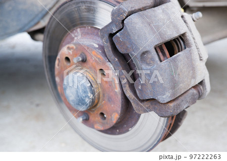 Car repair. Replacing the brake pads of disc brakes. Brake disc close-up. 97222263