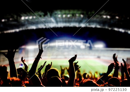 football or soccer fans at a game in a stadium world cup 97225130