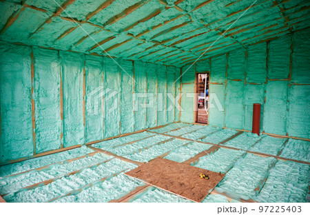 Wooden frame house thermal insulated by polyurethane foam. Construction and insulation concept. 97225403