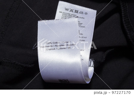 100 cotton tag in various languages on black jumper 97227170
