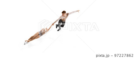 Death spiral. Portrait of young man and woman, figure skating athletes performing isolated over white studio background. Flyer Death spiral. Portrait of young man and woman, figure skating athletes performing isolated over white studio background. Flyer 97227862