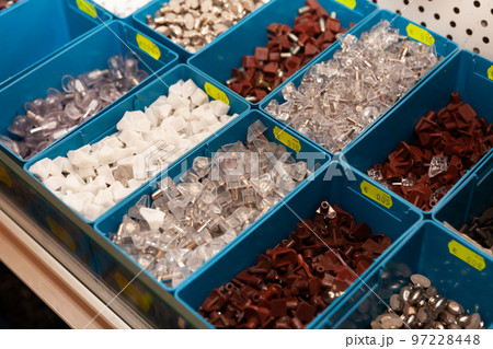 Boxes with furniture accessories in a hardware store 97228448