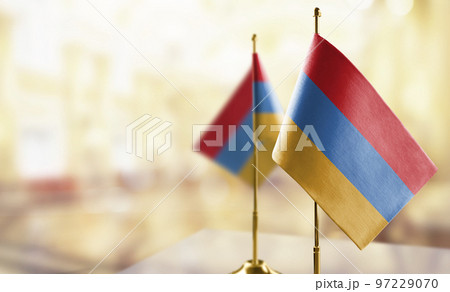 Small flags of the Armenia on an abstract blurry background 97229070