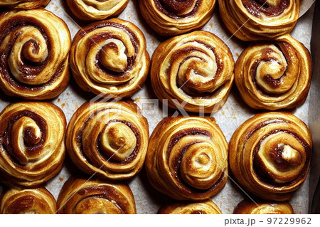 Golden brown appetizing cinnamon buns drizzled with caramel 97229962