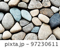 Natural grey pebble stones decorative background 97230611