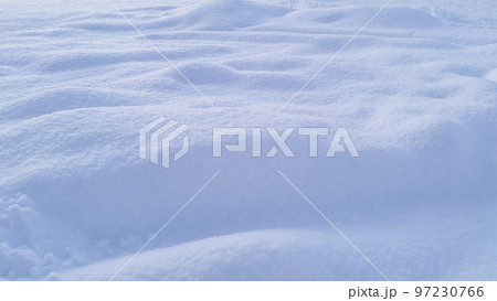 Natural winter background from snow falling on the ground 97230766