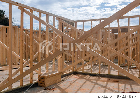 During construction of new house wood framing beams are used in order to support During construction of new house wood framing beams are used in order to support 97234937