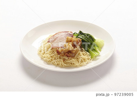 Chinese yellow egg noodles topping slice barbecue pork and boiled cabbage in a bowl 97239005