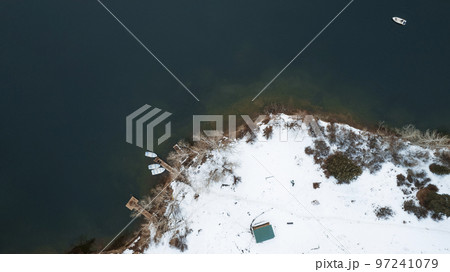 Kolsai mountain lake in the winter forest. 97241079