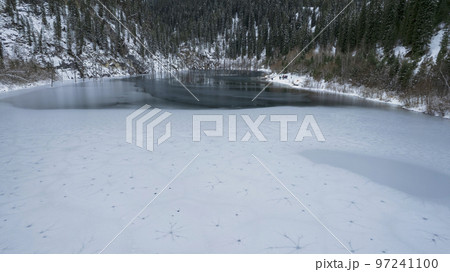 Unusual ice patterns on Kaindy Mountain Lake 97241100