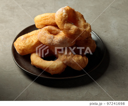 A dish with donuts. Hot street sweet food. Fast food A dish with donuts. Hot street sweet food. Fast food 97241698