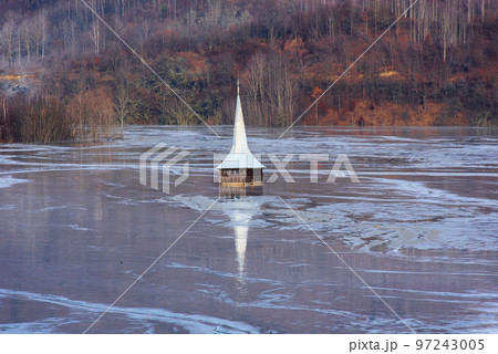 Drowned church at Geamana lake near gold mine 97243005