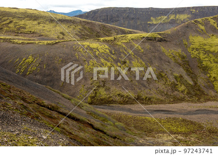 Volcanic landscape in Iceland. Lava flows with green moss 97243741