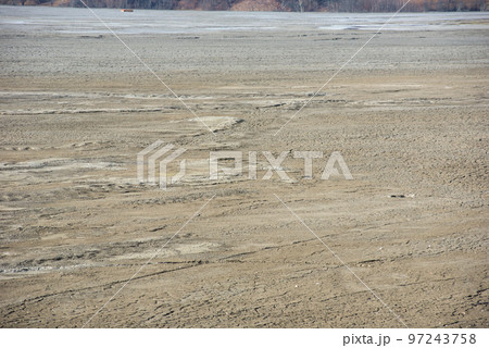 Muddy waters in a decantation pond. Toxic residuals from a copper mine decating in a settling basin Muddy waters in a decantation pond. Toxic residuals from a copper mine decating in a settling basin 97243758
