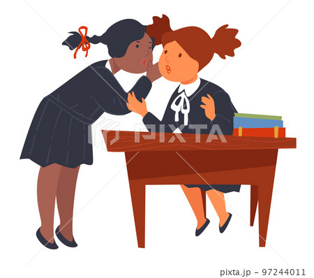 Female friends gossiping in school, pupils at desk Female friends gossiping in school, pupils at desk 97244011