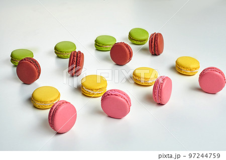 Colored macaron or macaroon, sweet meringue-based confection isolated on white. Close-up, copy space. 97244759