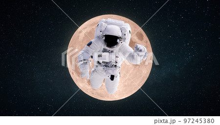 Space man astronaut flies in outer deep starry space on the background of the full moon. Space mission and trip to the moon, concept Space man astronaut flies in outer deep starry space on the background of the full moon. Space mission and trip to the moon, concept 97245380