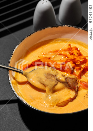 Close-up shot of a delicious cream soup with meat, top view. Close-up shot of a delicious cream soup with meat, top view. 97245402