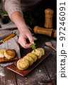 Vegetable zucchini pancakes with cheese, dill and parsley on a plate 97246091